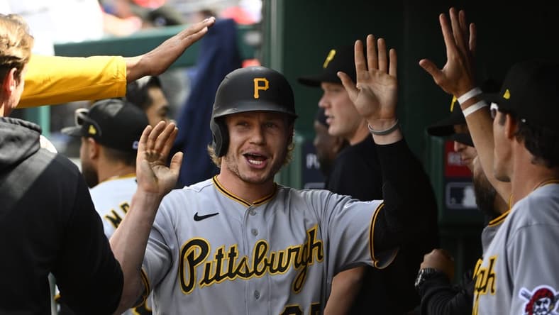 Apr 29, 2023; Washington, District of Columbia, USA; Pittsburgh Pirates center fielder Jack Suwinski (65) is congratulated by teammates after scoring a run during the eighth inning at Nationals Park. Mandatory Credit: Brad Mills-USA TODAY Sports
