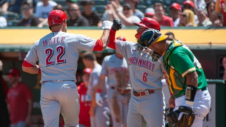 Apr 29, 2023; Oakland, California, USA; Cincinnati Reds second baseman Jonathan India (6) congratulates catcher Luke Maile (22) after he hit a home run during the second inning against the Oakland Athletics at RingCentral Coliseum. Mandatory Credit: Ed Szczepanski-USA TODAY Sports