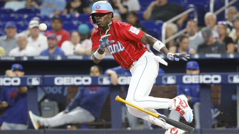 Apr 29, 2023; Miami, Florida, USA; Miami Marlins center fielder Jazz Chisholm Jr. (2) heads to first on his bunt single against the Chicago Cubs during the first inning at loanDepot Park. Mandatory Credit: Rhona Wise-USA TODAY Sports