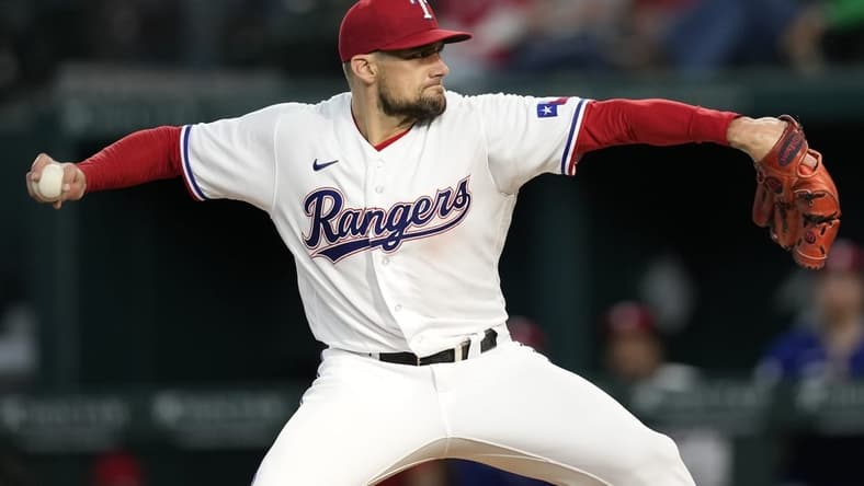 Apr 29, 2023; Arlington, Texas, USA; Texas Rangers starting pitcher Nathan Eovaldi (17) delivers a pitch to the New York Yankees during the first inning at Globe Life Field. Mandatory Credit: Jim Cowsert-USA TODAY Sports