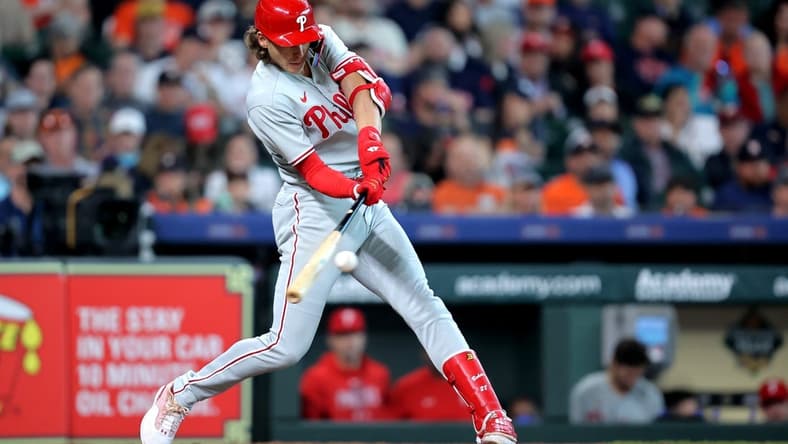 Apr 29, 2023; Houston, Texas, USA; Philadelphia Phillies third baseman Alec Bohm (28) hits an RBI double to right field against the Houston Astros during the eighth inning at Minute Maid Park. Mandatory Credit: Erik Williams-USA TODAY Sports