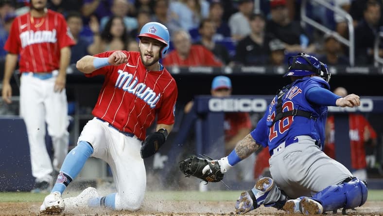 Apr 29, 2023; Miami, Florida, USA; Miami Marlins shortstop Garrett Hampson (1) scores against the Chicago Cubs during the third inning at loanDepot Park. Mandatory Credit: Rhona Wise-USA TODAY Sports
