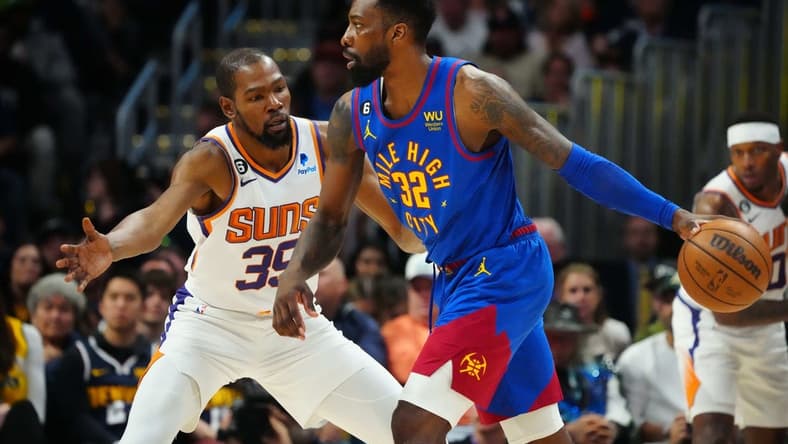 Apr 29, 2023; Denver, Colorado, USA; Denver Nuggets forward Jeff Green (32) controls the ball while defended by Phoenix Suns forward Kevin Durant (35) in the first half during game one of the 2023 NBA Playoffs at Ball Arena. Mandatory Credit: Ron Chenoy-USA TODAY Sports