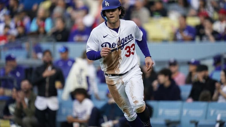 Apr 29, 2023; Los Angeles, California, USA;  Los Angeles Dodgers center fielder James Outman (33) scores a run against the St. Louis Cardinals during the second inning at Dodger Stadium. Mandatory Credit: Lucas Peltier-USA TODAY Sports