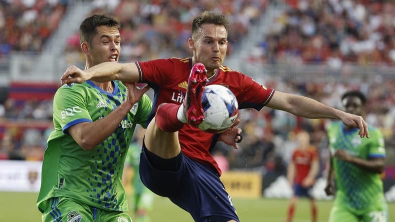 Apr 29, 2023; Sandy, Utah, USA;  Seattle Sounders defender Jackson Ragen (25) and Real Salt Lake forward Danny Musovski (17) battle in the first half at America First Field. Mandatory Credit: Jeffrey Swinger-USA TODAY Sports