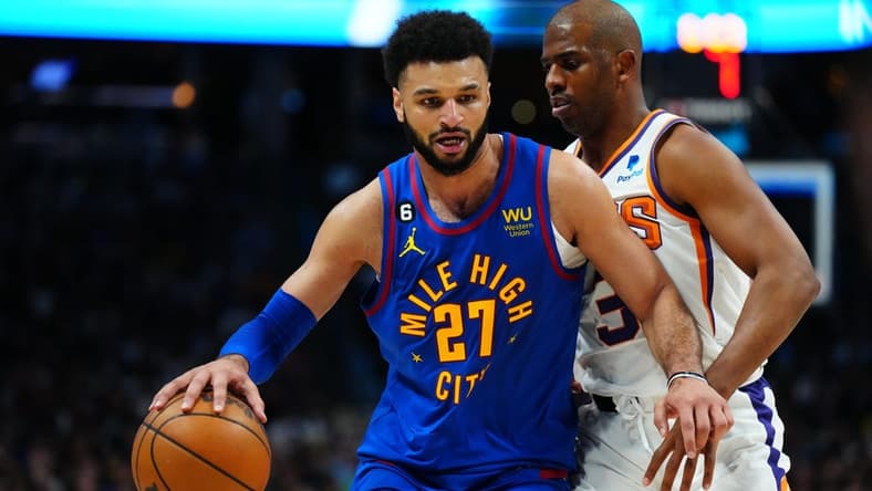 Apr 29, 2023; Denver, Colorado, USA; Denver Nuggets guard Jamal Murray (27) drives past Phoenix Suns guard Chris Paul (3) in the second half during game one of the 2023 NBA Playoffs at Ball Arena. Mandatory Credit: Ron Chenoy-USA TODAY Sports