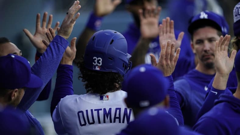Apr 29, 2023; Los Angeles, California, USA; Los Angeles Dodgers center fielder James Outman (33) is greeted by teammates after scoring a run against the St. Louis Cardinals during the second inning at Dodger Stadium. Mandatory Credit: Lucas Peltier-USA TODAY Sports