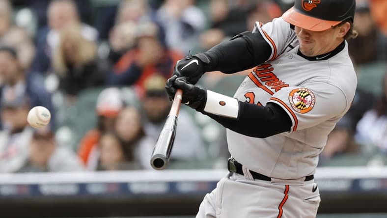 Apr 30, 2023; Detroit, Michigan, USA;  Baltimore Orioles catcher Adley Rutschman (35) hits a double in the third inning against the Detroit Tigers at Comerica Park. Mandatory Credit: Rick Osentoski-USA TODAY Sports