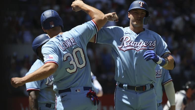 Apr 30, 2023; Arlington, Texas, USA;  Texas Rangers third baseman Josh Jung (6) celebrates with Texas Rangers first baseman Nathaniel Lowe (30) after hitting a grand slam during the first inning against the New York Yankees at Globe Life Field. Mandatory Credit: Kevin Jairaj-USA TODAY Sports