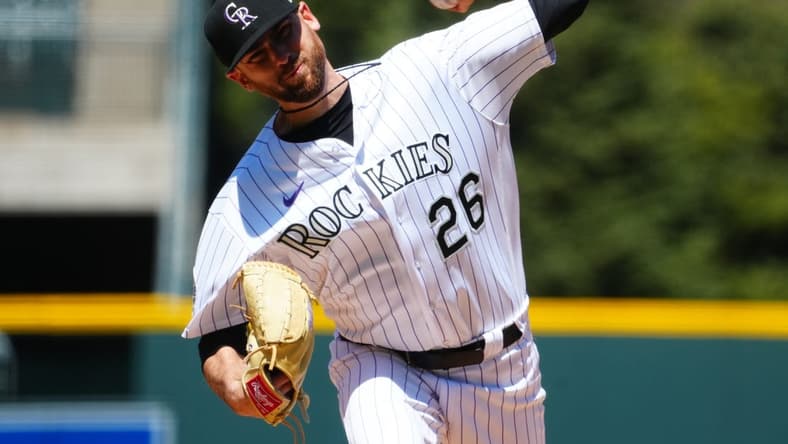 Apr 30, 2023; Denver, Colorado, USA; Colorado Rockies starting pitcher Austin Gomber (26) delivers a pitch in the first inning against the Arizona Diamondbacks at Coors Field. Mandatory Credit: Ron Chenoy-USA TODAY Sports