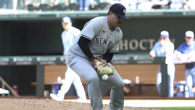 Apr 30, 2023; Arlington, Texas, USA;  New York Yankees relief pitcher Nick Ramirez (63) bobbles the ball during the eighth inning against the Texas Rangers at Globe Life Field. Mandatory Credit: Kevin Jairaj-USA TODAY Sports