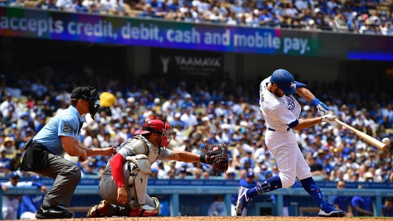 Apr 30, 2023; Los Angeles, California, USA; Los Angeles Dodgers shortstop Chris Taylor (3) hits an RBI double against the St. Louis Cardinals during the fourth inning at Dodger Stadium. Mandatory Credit: Gary A. Vasquez-USA TODAY Sports