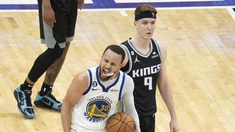 April 30, 2023; Sacramento, California, USA; Golden State Warriors guard Stephen Curry (30) celebrates in front of Sacramento Kings guard Kevin Huerter (9) during the fourth quarter in game seven of the 2023 NBA playoffs first round at Golden 1 Center. Mandatory Credit: Kyle Terada-USA TODAY Sports