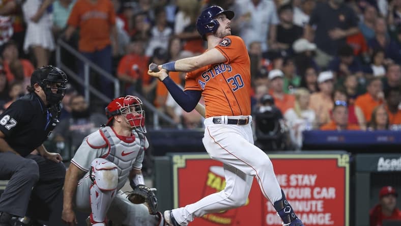 Apr 30, 2023; Houston, Texas, USA; Houston Astros right fielder Kyle Tucker (30) drives in a run with a single during the fifth inning against the Philadelphia Phillies at Minute Maid Park. Mandatory Credit: Troy Taormina-USA TODAY Sports