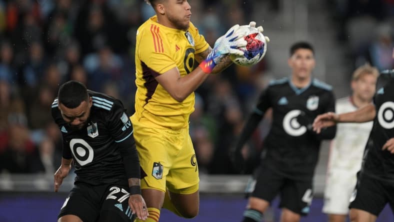 Apr 30, 2023; Saint Paul, Minnesota, USA; Minnesota United goalkeeper Dayne St. Clair (97) controls the ball in front of defender D.J. Taylor (27) in the first half against the FC Dallas at Allianz Field. Mandatory Credit: Matt Blewett-USA TODAY Sports