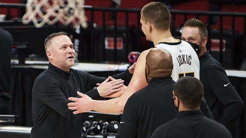 Nuggets head coach Michael Malone and center Nikola Jokic (15) were ignited by the media narrative around the Lakers after Game 1. Mandatory Credit: Troy Wayrynen-USA TODAY Sports