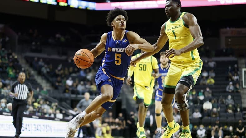 Dec 1, 2021; Eugene, Oregon, USA; UC Riverside Highlanders guard Zyon Pullin (5) drives to the basket against Oregon Ducks center N'Faly Dante (1) during the second half at Matthew Knight Arena. Mandatory Credit: Soobum Im-USA TODAY Sports