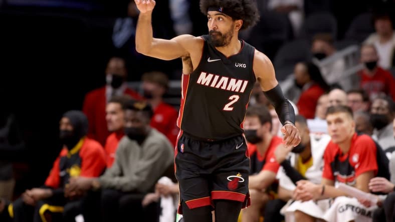 Jan 12, 2022; Atlanta, Georgia, USA; Miami Heat guard Gabe Vincent (2) reacts after a basket during the fourth quarter against the Atlanta Hawks at State Farm Arena. Mandatory Credit: Jason Getz-USA TODAY Sports