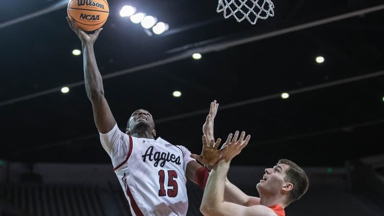 Mike Peake (15) goes up for a layup as the New Mexico State Aggies face the Dixie State Trailblazers at the Pan American Center in Las cruces on Wednesday, Feb. 16, 2022.

Nmsu Dsu 4