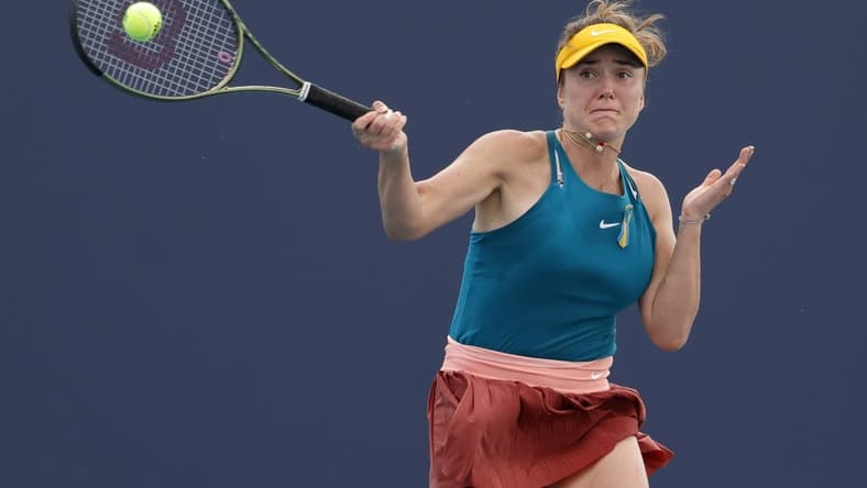 Mar 24, 2022; Miami Gardens, FL, USA; Elina Svitolina (UKR) hits a forehand against Heather Watson (GBR) (not pictured) in a second round women's singles match in the Miami Open at Hard Rock Stadium. Mandatory Credit: Geoff Burke-USA TODAY Sports