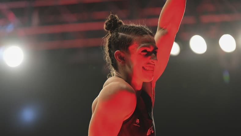 Apr 9, 2022; Jacksonville, Florida, USA; Mackenzie Dern (red gloves) after winning a fight against Tecia Torres (blue gloves) during UFC 273 at VyStar Veterans Memorial Arena. Mandatory Credit: David Yeazell-USA TODAY Sports