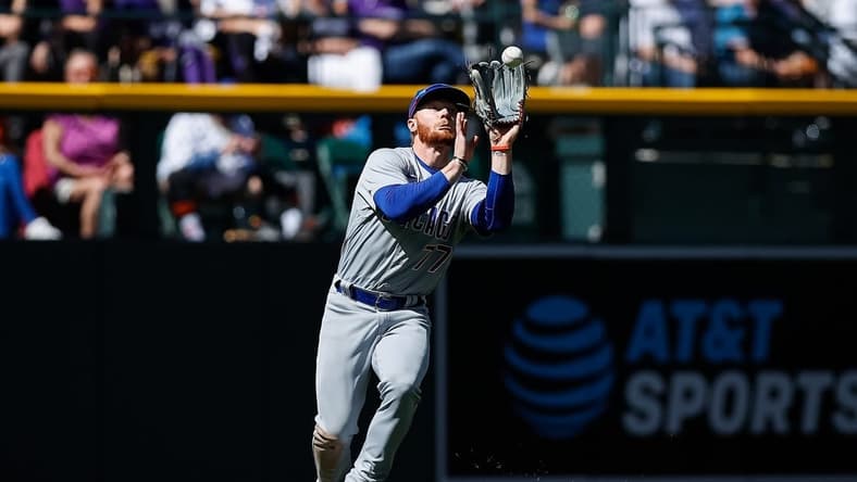 Apr 17, 2022; Denver, Colorado, USA; Chicago Cubs left fielder Clint Frazier (77) makes a catch for an out in the fifth inning against the Colorado Rockies at Coors Field. Mandatory Credit: Isaiah J. Downing-USA TODAY Sports
