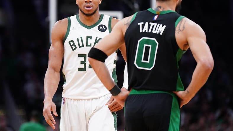 May 1, 2022; Boston, Massachusetts, USA; Milwaukee Bucks forward Giannis Antetokounmpo (34) and Boston Celtics forward Jayson Tatum (0) on the court in the second half during game one of the second round for the 2022 NBA playoffs at TD Garden. Mandatory Credit: David Butler II-USA TODAY Sports