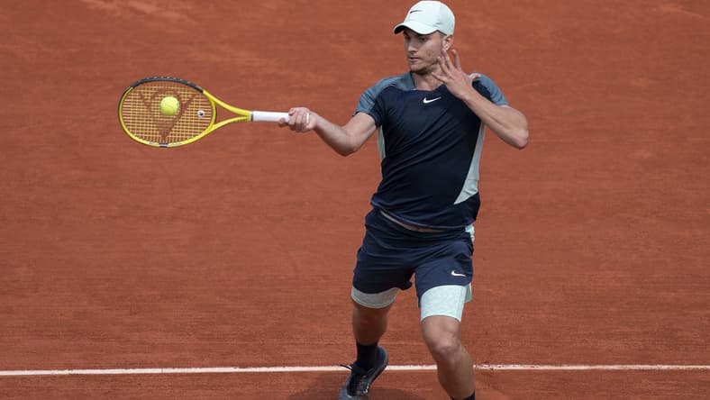 May 28, 2022; Paris, France; Miomir Kecmanovic (SRB) returns a shot from Daniil Medvedev during their match on day seven of the French Open at Stade Roland-Garros. Mandatory Credit: Susan Mullane-USA TODAY Sports