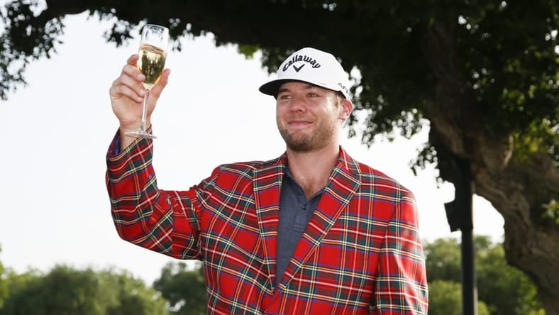 May 29, 2022; Fort Worth, Texas, USA; Sams Burns toasts to his victory following the final round of the Charles Schwab Challenge golf tournament. Mandatory Credit: Raymond Carlin III-USA TODAY Sports