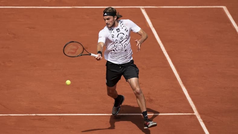 May 30, 2022; Paris, France; Stefanos Tsitsipas (GRE) returns a shot in his match against Holger Rune (DEN) on day nine of the French Open at Stade Roland-Garros. Mandatory Credit: Susan Mullane-USA TODAY Sports