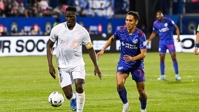 May 28, 2022; Montreal, Quebec, CAN; CF Montreal midfielder Victor Wanyama (2) plays the ball against FC Cincinnati forward Yuya Kubo (7) during the second half at Stade Saputo. Mandatory Credit: David Kirouac-USA TODAY Sports
