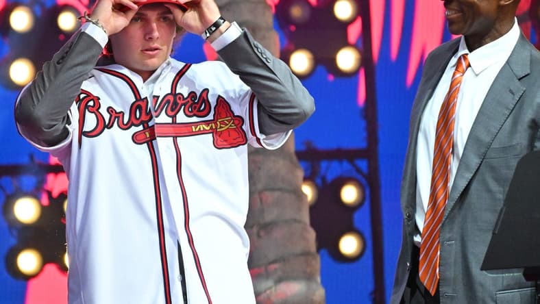 Jul 17, 2022; Los Angeles, CA, USA; Former Atlanta Braves player Fred McGriff presents JR Ritchie right with his jersey after he was selected by the Atlanta Braves as the 35th pick of the MLB draft at XBox Plaza at LA Live. Mandatory Credit: Jayne Kamin-Oncea-USA TODAY Sports