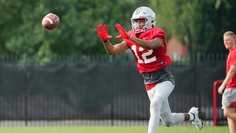 Aug 4, 2022; Columbus, OH, USA; Ohio State Buckeyes wide receiver Caleb Burton (12) catches a pass during the first fall football practice at the Woody Hayes Athletic Center. Mandatory Credit: Adam Cairns-The Columbus Dispatch
Ohio State Football First Practice