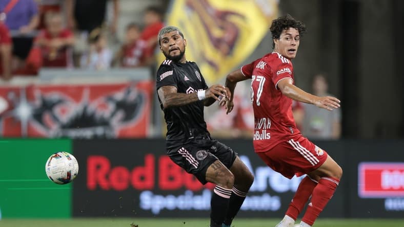 Aug 27, 2022; Harrison, New Jersey, USA; Inter Miami defender DeAndre Yedlin (2) battles for the ball against New York Red Bulls midfielder Caden Clark (37) at Red Bull Arena. Mandatory Credit: Vincent Carchietta-USA TODAY Sports