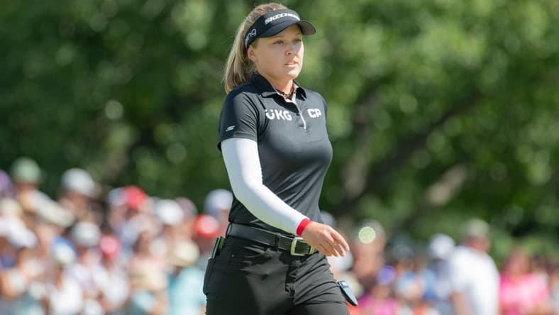 Aug 28, 2022; Ottawa, Ontario, CAN; Brooke Henderson from Canada  walks on the 18th hole green during the final round of the CP Women's Open golf tournament. Mandatory Credit: Marc DesRosiers-USA TODAY Sports