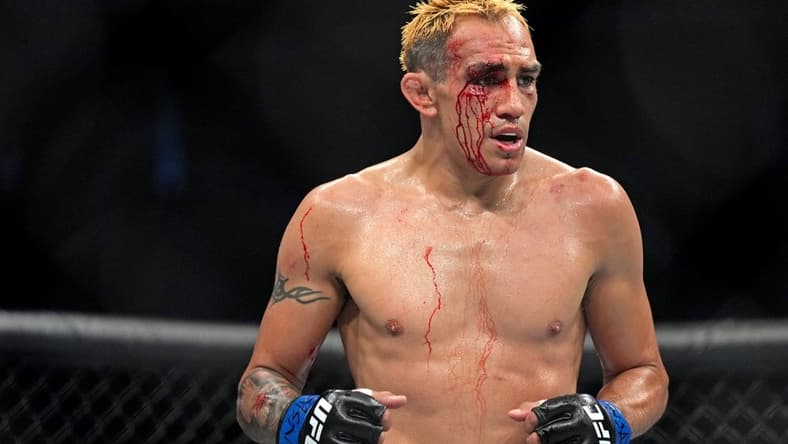 Sep 10, 2022; Las Vegas, Nevada, USA; Tony Ferguson (blue gloves) during UFC 279 at T-Mobile Arena. Mandatory Credit: Joe Camporeale-USA TODAY Sports