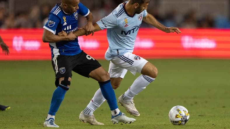 Sep 17, 2022; San Jose, California, USA; San Jose Earthquakes midfielder Judson (93) holds back FC Dallas midfielder Facundo Quignon (5) during the second half at PayPal Park. Mandatory Credit: Stan Szeto-USA TODAY Sports