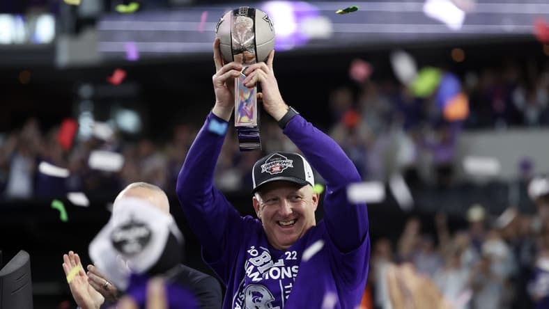 Dec 3, 2022; Arlington, TX, USA; Kansas State Wildcats head coach Chris Klieman holds up the Big 12 Championship trophy after the game against the TCU Horned Frogs at AT&T Stadium. Mandatory Credit: Kevin Jairaj-USA TODAY Sports