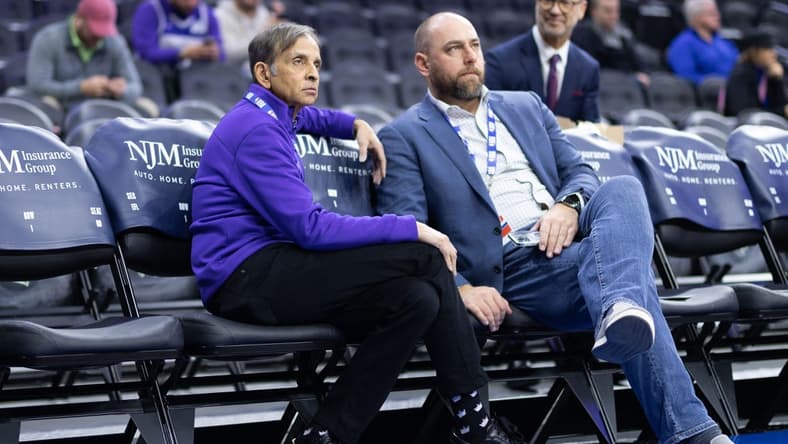 Dec 13, 2022; Philadelphia, Pennsylvania, USA; Sacramento Kings owner Vivek Ranadive (L) and general manager Monte McNair (R) look on during warm ups before a game against the Philadelphia 76ers at Wells Fargo Center. Mandatory Credit: Bill Streicher-USA TODAY Sports