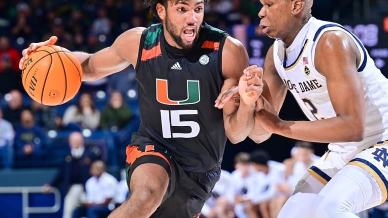 Dec 30, 2022; South Bend, Indiana, USA; Miami Hurricanes forward Norchad Omier (15) drives to the basket as Notre Dame Fighting Irish forward Ven-Allen Lubin (2) defends in the second half at the Purcell Pavilion. Mandatory Credit: Matt Cashore-USA TODAY Sports