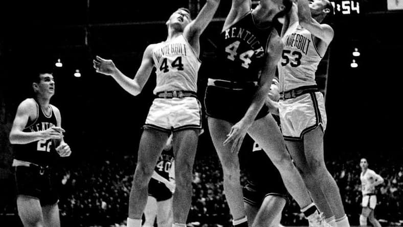 Kentucky point leader Cotton Nash (44), middle, bats a ball off the board in the second half between Bob Scott (44) and Bob Grace (53) of Vanderbilt Jan. 7, 1963. The Wildcats defeated the Commodores 106-82 before 7,324 fans at Memorial Gym Jan. 7, 1963.