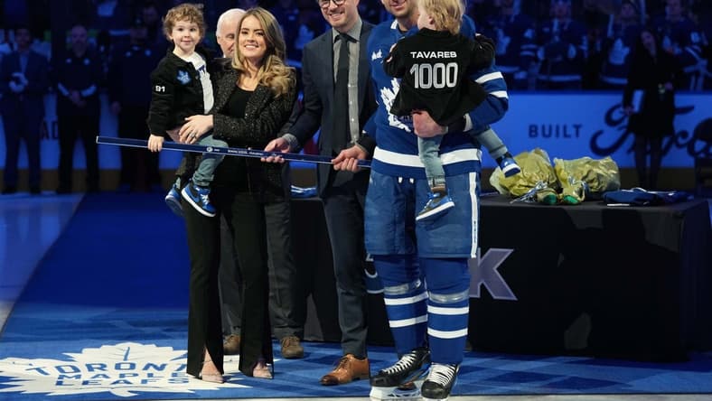 Jan 29, 2023; Toronto, Ontario, CAN; Toronto Maple Leafs center John Tavares (91) receives a commemorative hockey stick from Toronto Maple Leafs General Manager Kyle Dubas for his1000th NHL game ceremony against the Washington Capitals at Scotiabank Arena. Mandatory Credit: Nick Turchiaro-USA TODAY Sports