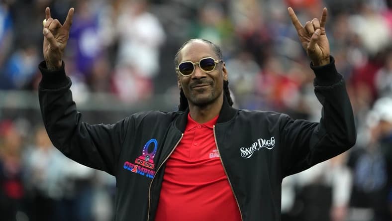 Feb 5, 2023; Paradise, Nevada, USA; AFC captain and recording artist Snoop Dogg watches from the sidelines against the NFC during the Pro Bowl Games at Allegiant Stadium. Mandatory Credit: Kirby Lee-USA TODAY Sports
