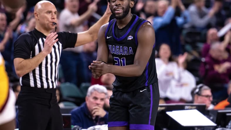 Mar 10, 2023; Atlantic City, NJ, USA; Niagara Purple Eagles guard Noah Thomasson (21) reacts during the second half against the Iona Gaels at Jim Whelan Boardwalk Hall. Mandatory Credit: John Jones-USA TODAY Sports