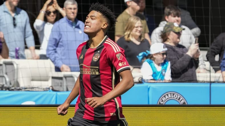 Mar 11, 2023; Charlotte, North Carolina, USA; Atlanta United defender Caleb Wiley (26) celebrates his goal against the Charlotte FC during the first half at Bank of America Stadium. Mandatory Credit: Jim Dedmon-USA TODAY Sports