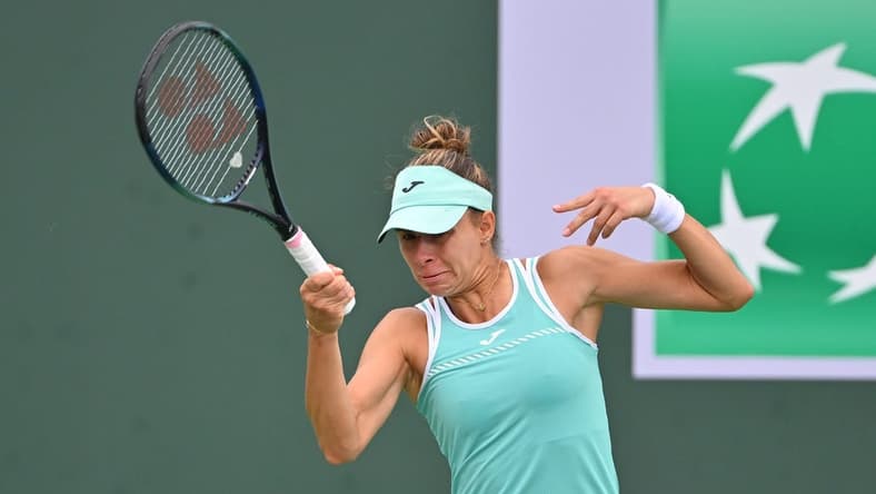 Mar 11, 2023; Indian Wells, CA, USA;  Magda Linette (POL)  hits a shot in her second round match against Emma Raducanu (GBR) in the BNP Paribas Open at the Indian Wells Tennis Garden. Mandatory Credit: Jayne Kamin-Oncea-USA TODAY Sports