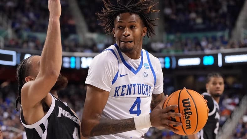 Mar 17, 2023; Greensboro, NC, USA; Kentucky Wildcats forward Daimion Collins (4) controls the ball against Providence Friars guard Jared Bynum (4) in the second half at Greensboro Coliseum. Mandatory Credit: Bob Donnan-USA TODAY Sports