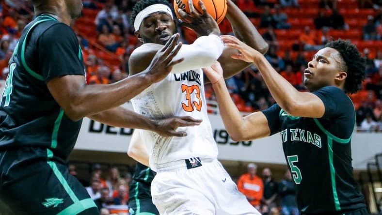 Oklahoma State forward Moussa Cisse (33) works past defenders in the first half during a college basketball game in the quarterfinals of the National Invitational Tournament between the Oklahoma State Cowboys (OSU) and the North Texas Mean Green at Gallagher-Iba Arena in Stillwater, Okla., Tuesday, March 21, 2023.

Osu Vs Nt