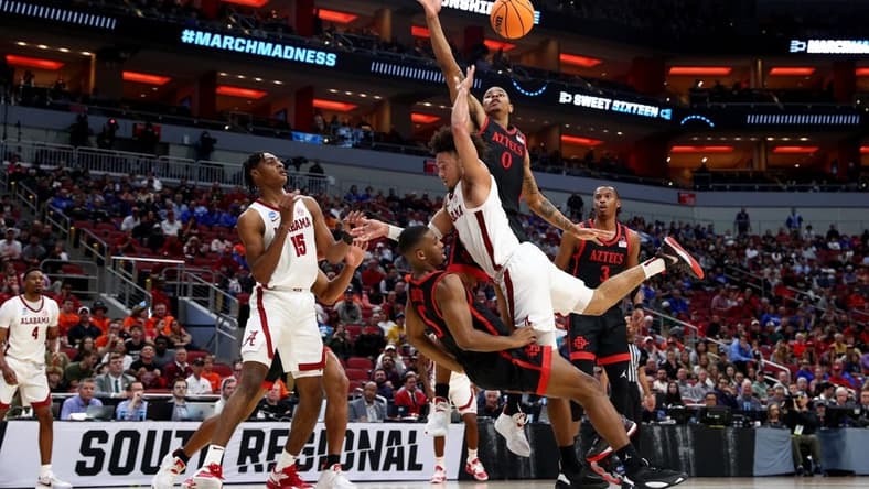 Mar 24, 2023; Louisville, KY, USA; Alabama Crimson Tide guard Mark Sears (1) charges into San Diego State Aztecs guard Lamont Butler (5) during the first half of the NCAA tournament round of sixteen at KFC YUM! Center. Mandatory Credit: Jordan Prather-USA TODAY Sports