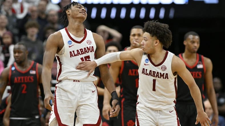 Mar 24, 2023; Louisville, KY, USA; Alabama Crimson Tide forward Noah Clowney (15) and Alabama Crimson Tide guard Mark Sears (1) react after a play during the second half of the NCAA tournament round of sixteen against the San Diego State Aztecs at KFC YUM! Center. Mandatory Credit: Jamie Rhodes-USA TODAY Sports